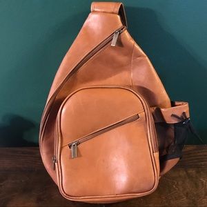 Cognac sling crossbody backpack.
